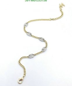 Gold chain bracelet with diamond accents.