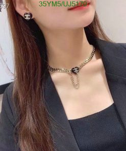 Woman wearing elegant necklace and earrings.