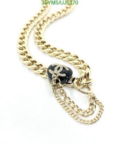 Gold chain necklace with pendant detail.