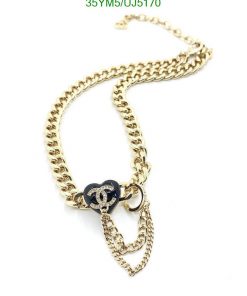 Gold chain necklace with logo pendant on white background.