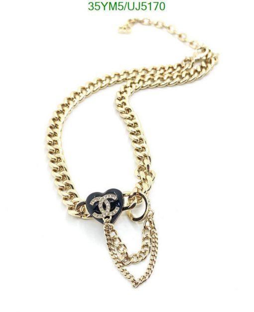 Gold chain necklace with logo pendant on white background.