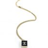 Gold pendant necklace on white background