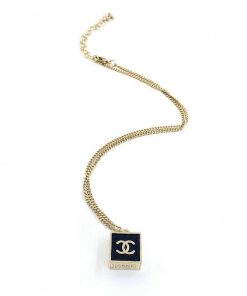 Gold pendant necklace on white background