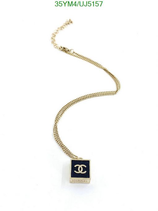 Gold pendant necklace on white background