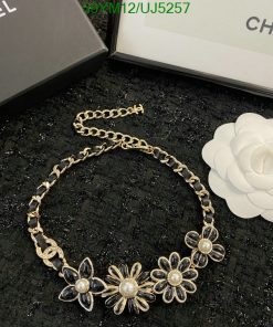 Chanel pearl flower necklace with box and camellia flower.