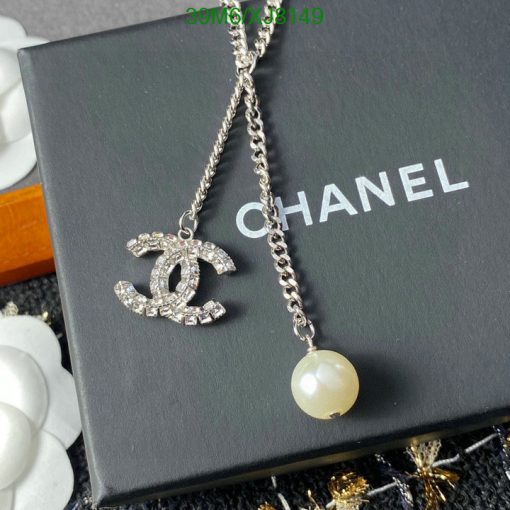 Designer logo necklace with pearl on branded box.