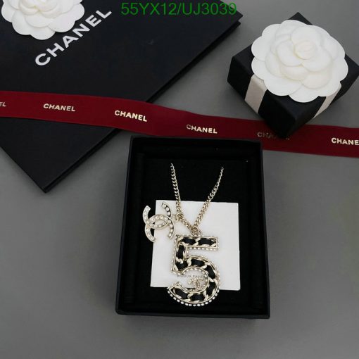 Chanel necklace with number 5 in presentation box.