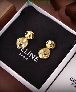 Gold designer earrings in branded box.