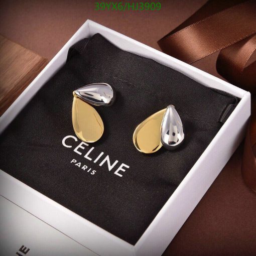 Celine gold and silver teardrop cufflinks in box.