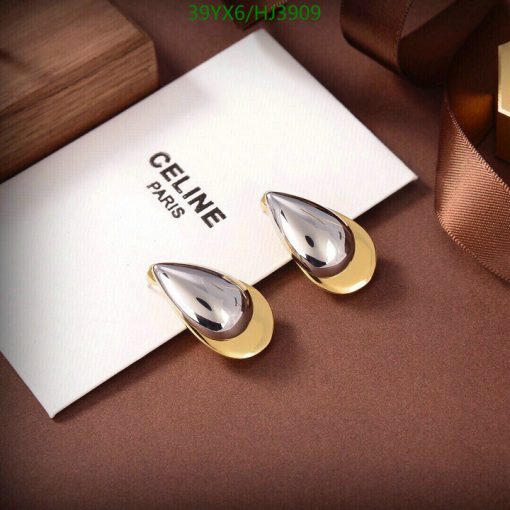 Elegant designer gold teardrop earrings on display.