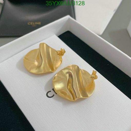 Gold designer earrings in box.