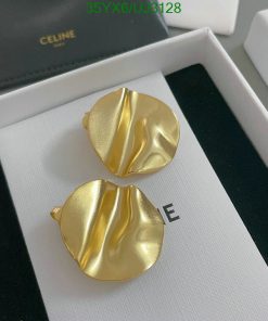 Gold designer textured earrings on display box.