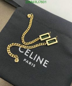 Celine Paris label with gold chain and green earrings.