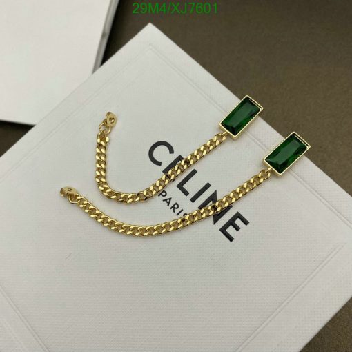 Gold chain earrings with green rectangular gems.