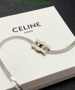 Celine Paris silver bracelet on white box.