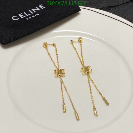 Gold Celine Paris bowtie-shaped drop earrings.