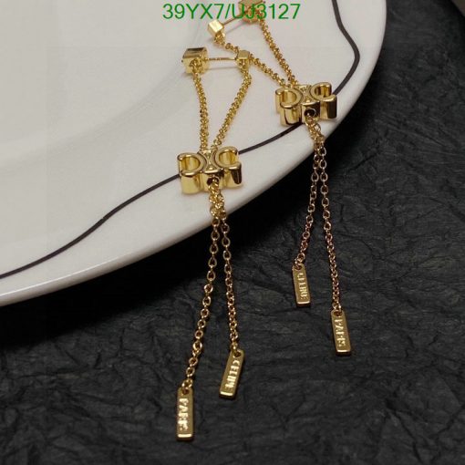 Gold barbell earrings with chain dangles.