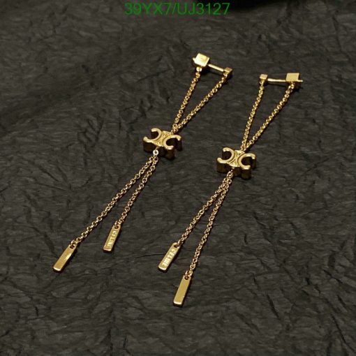 Gold puzzle piece earrings on black background.