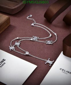 Elegant silver necklace on display with luxury branding.