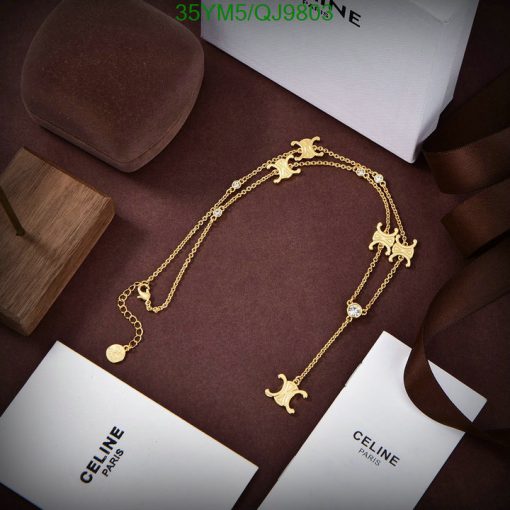 Elegant gold necklace displayed with luxury branding.