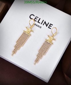 Gold tassel earrings on branded display box