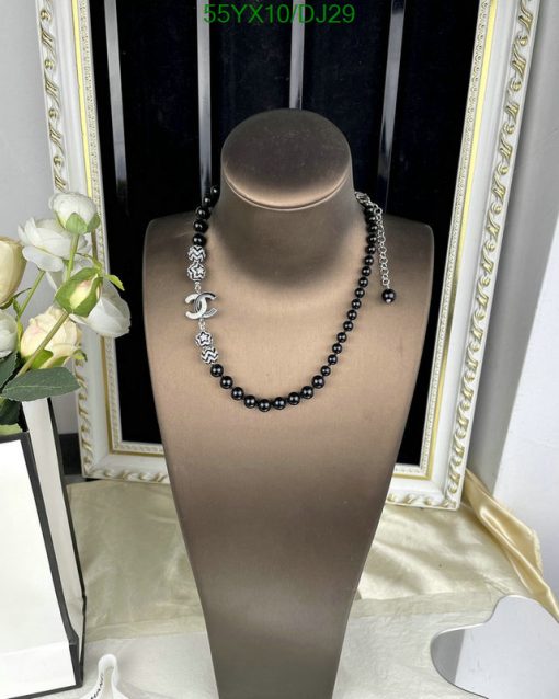 Elegant black bead necklace on mannequin display.