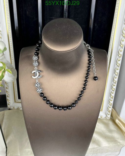 Elegant beaded necklace on mannequin display.