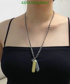 Woman wearing personalized pendant necklace.