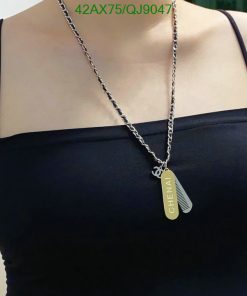 Woman wearing necklace with personalized pendant.