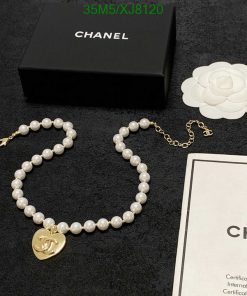 Chanel pearl necklace with logo pendant and packaging.