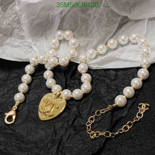 Pearl necklace and bracelet with gold heart pendant.