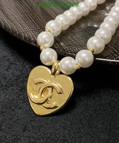 Elegant pearl necklace with gold heart pendant.