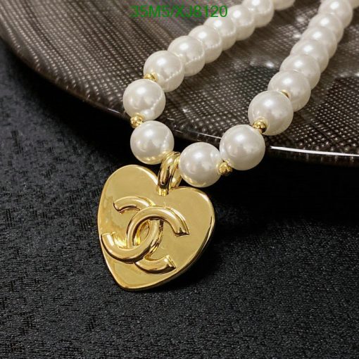 Elegant pearl necklace with gold heart pendant.