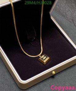 Gold pendant necklace in box.