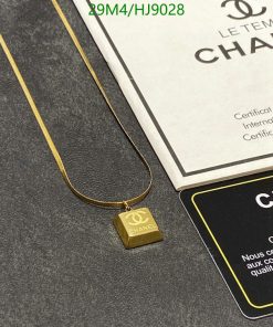 Gold necklace with pendant and authenticity certificate.