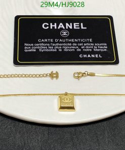 Chanel necklace with authenticity card on display