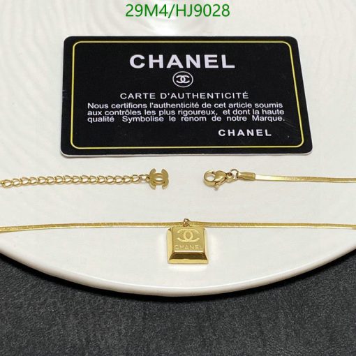 Chanel necklace with authenticity card on display