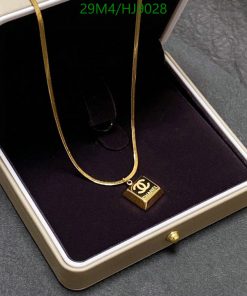 Gold pendant necklace in velvet box.