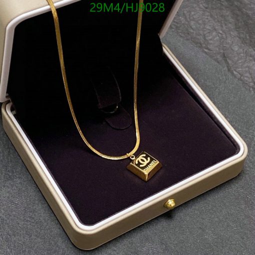 Gold pendant necklace in velvet box.