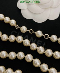 Elegant pearl necklace on black background.