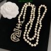 Pearl necklace with flower brooch and pendant.