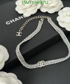 Diamond bracelet on display with Chanel logo.