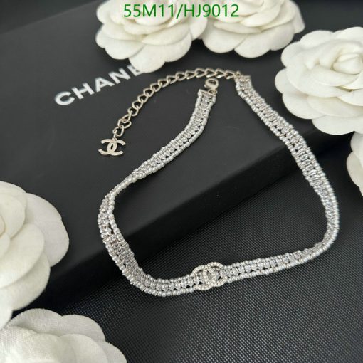 Diamond bracelet on display with Chanel logo.