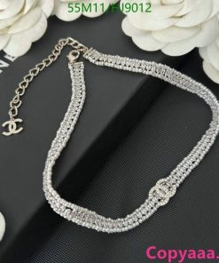 Rhinestone choker necklace on floral background.