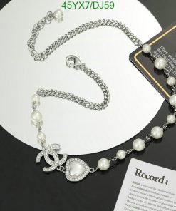 Silver pearl necklace on display with elegance.