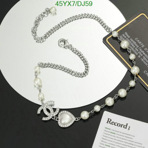 Silver pearl necklace on display with elegance.