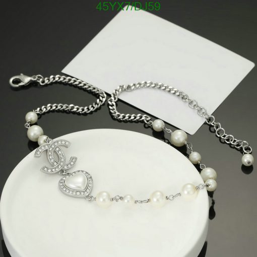 Pearl and diamond bracelet on white display