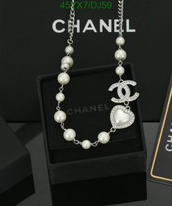 Chanel pearl necklace with logo pendant on display.