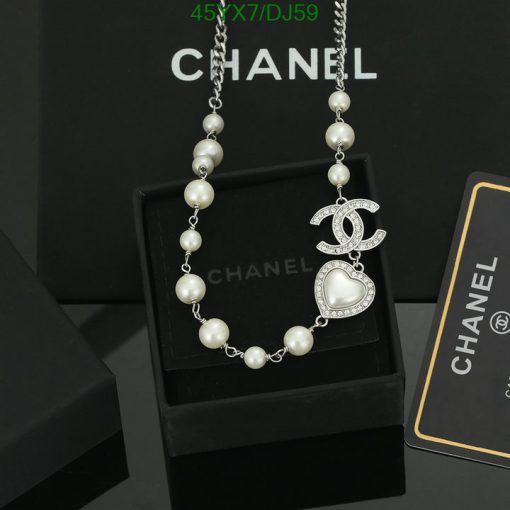 Chanel pearl necklace with logo pendant on display.