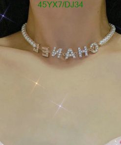 Woman wearing a custom sparkly name necklace.